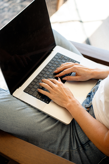 writing a grant on a laptop